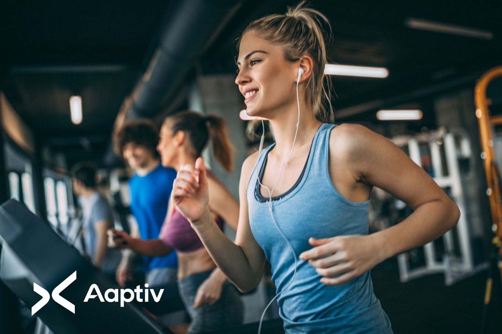 woman running on treadmill with headphones in