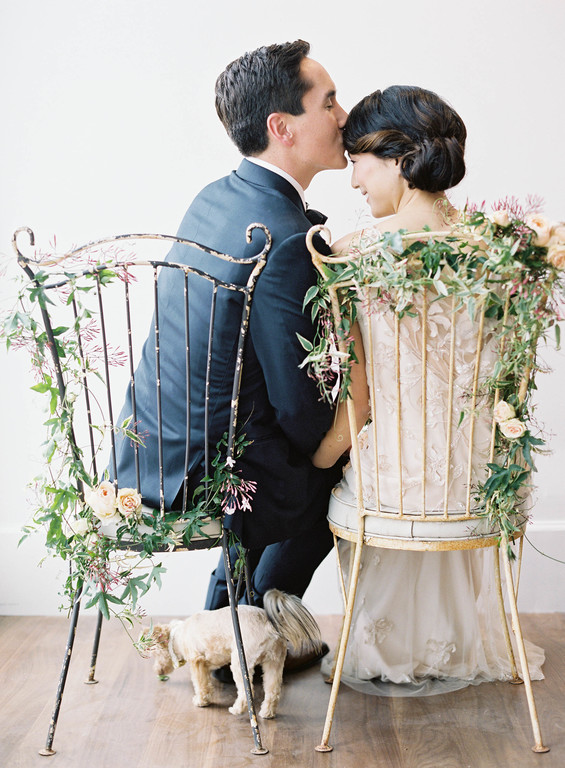 Wedding couple in decorated chairs