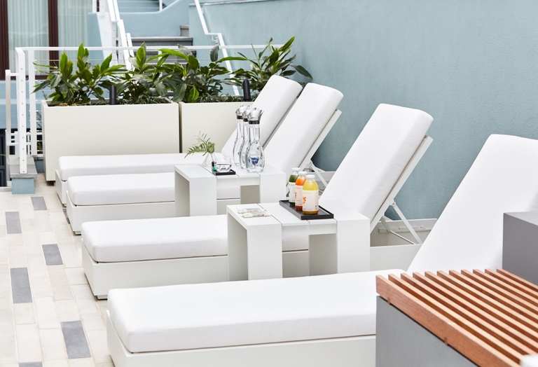 Spa lounge chairs with juices and essential oils